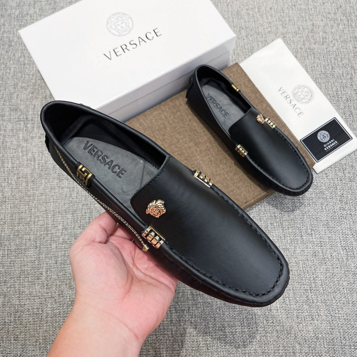 Versace Black Leather Loafers with Gold-Tone Accents — model