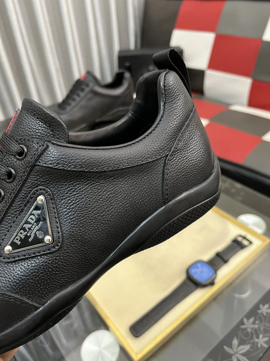 Prada Black Lace-Up Sneakers with Red Tab — detail