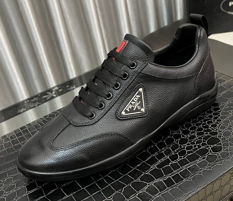 Prada Black Lace-Up Sneakers with Red Tab — hero
