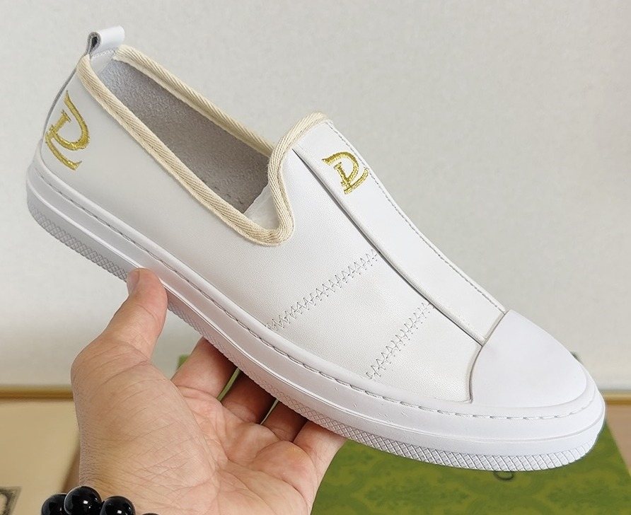 Gucci Brown Slip-On Sneakers with White Toe Caps — front