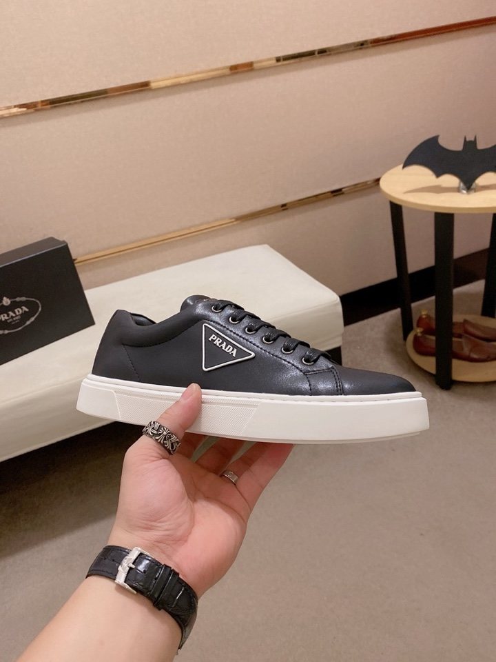 Prada Plaque Low-Top Sneakers — model